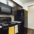 a kitchen with black appliances